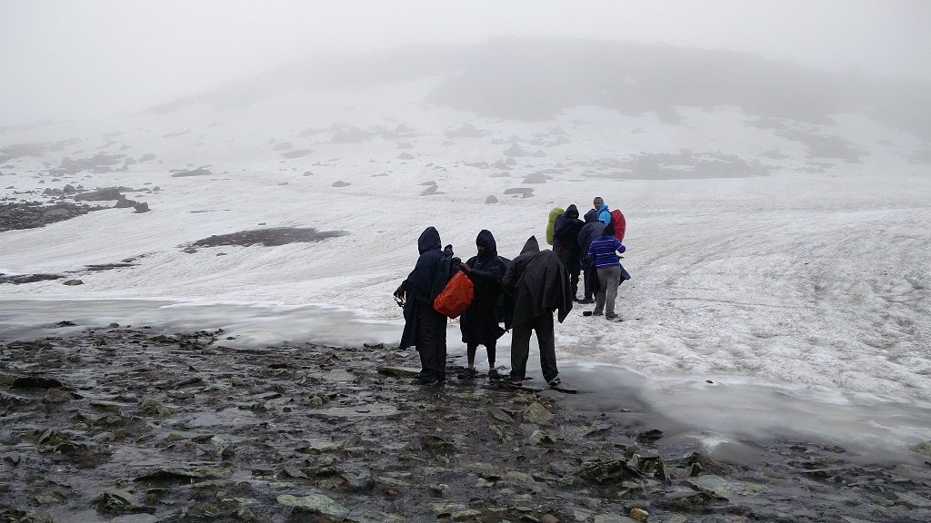 trekkers on rupin pass summit point